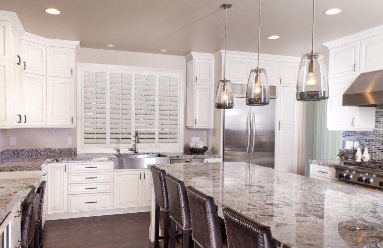 Plantation shutters covering a kitchen window